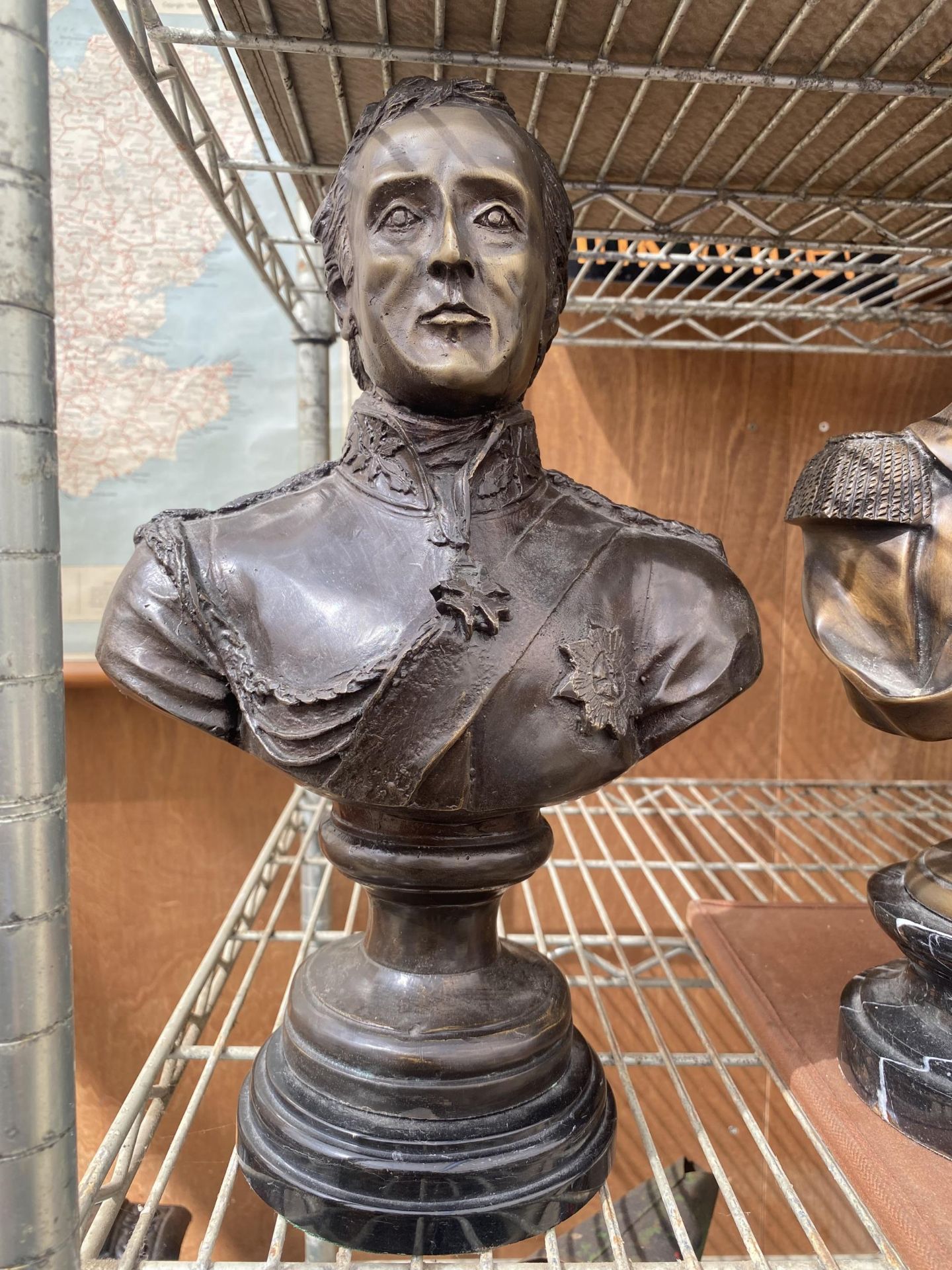 A REPRODUCTION BRONZE BUST OF AN OFFICER ON MARBLE BASE