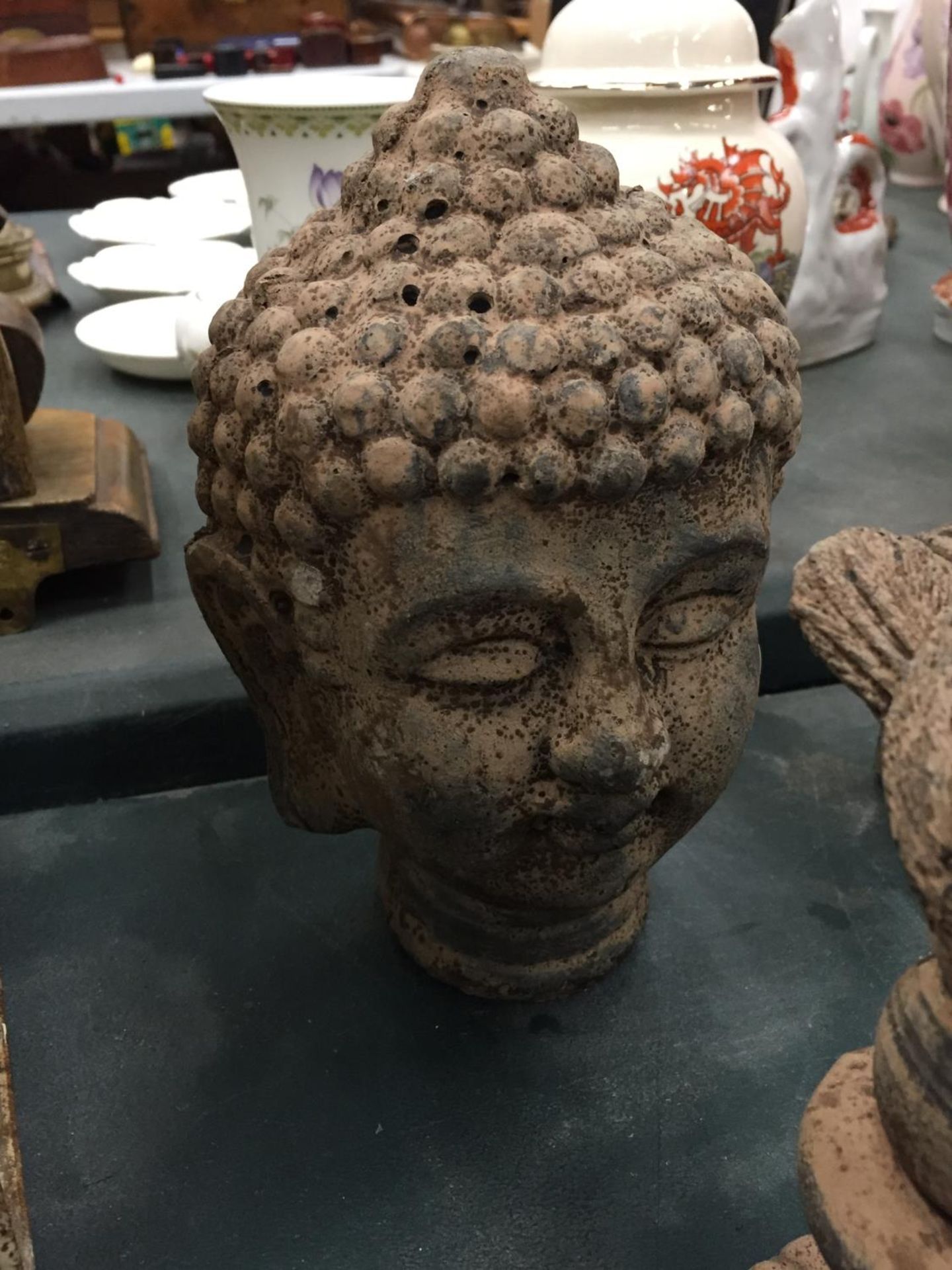 A STONEWARE HEAD OF A BUDDAH HEIGHT 20CM