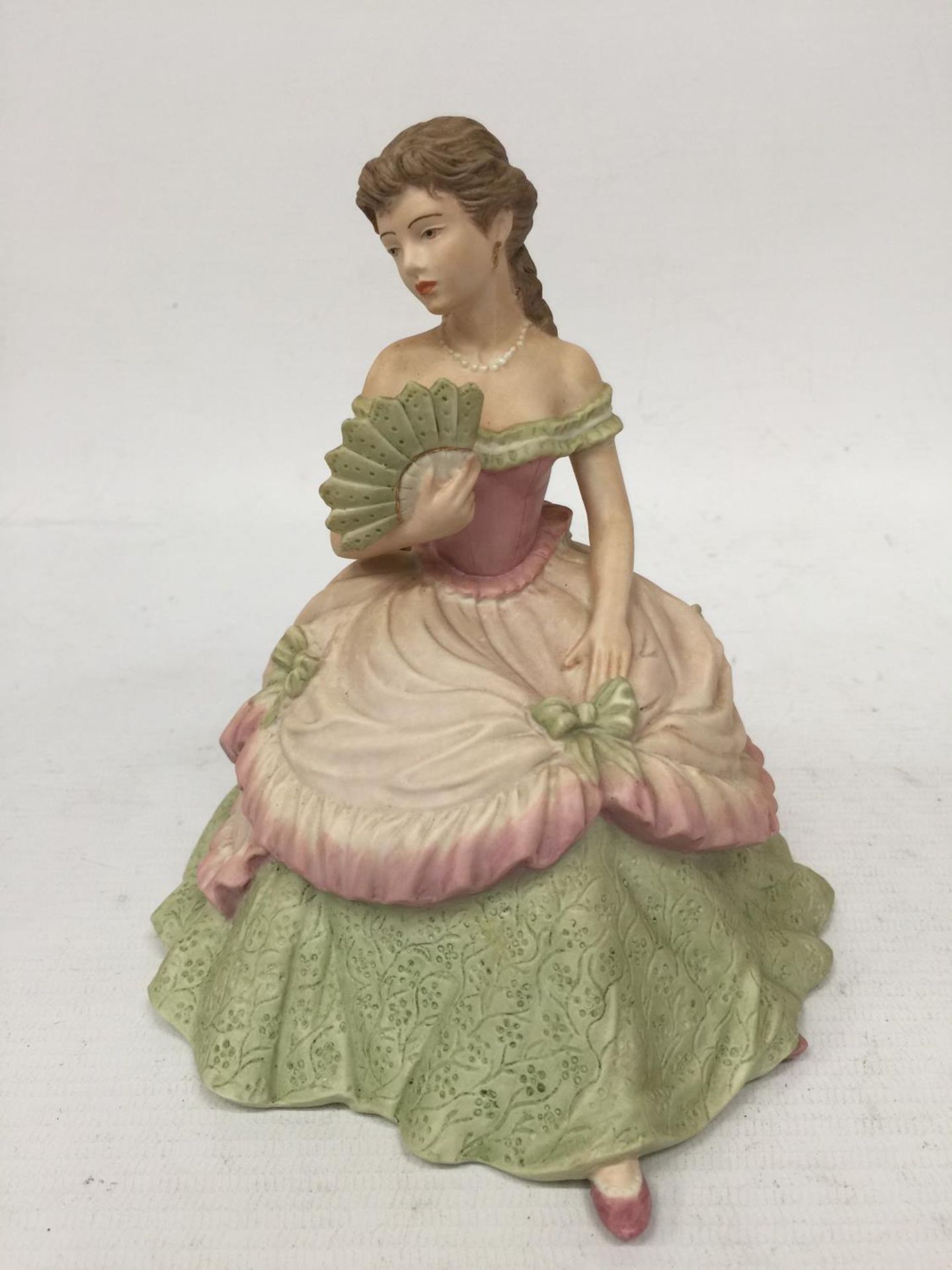 A COALPORT FIGURINE "INTERLUDE" FROM THE AGE OF ELEGANCE COLLECTION 1991 WITH A MATT FINISH - 17 CM