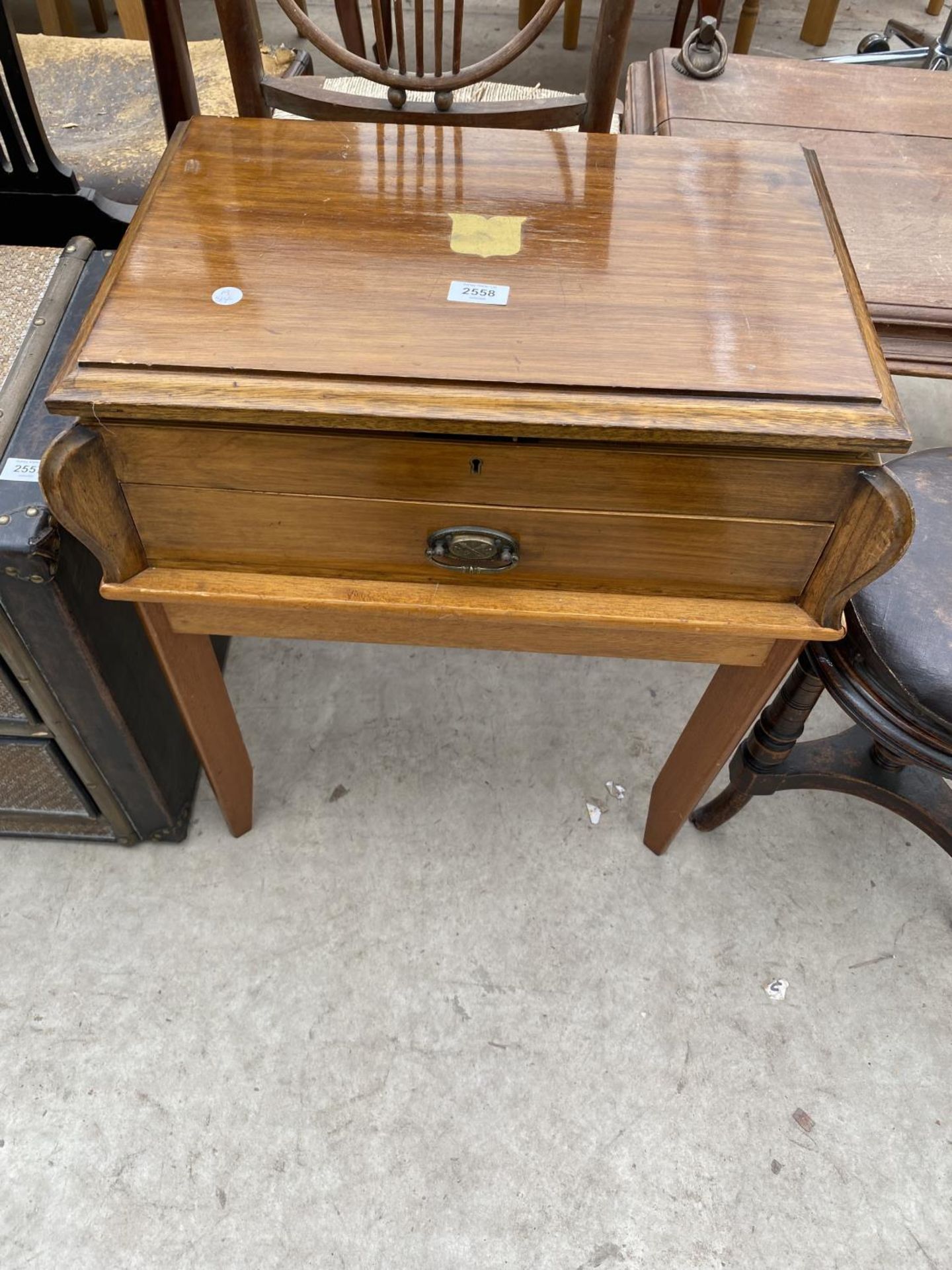 AN EDWARDIAN MAHOGANY CUTLERY CANTEEN ON LEGS WITH MAINLY MARTIN HALL & CO CUTLERY