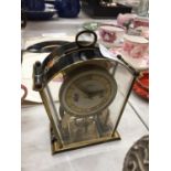 A SMALL GERMAN MANTLE CLOCK WITH FLORAL PATTERN