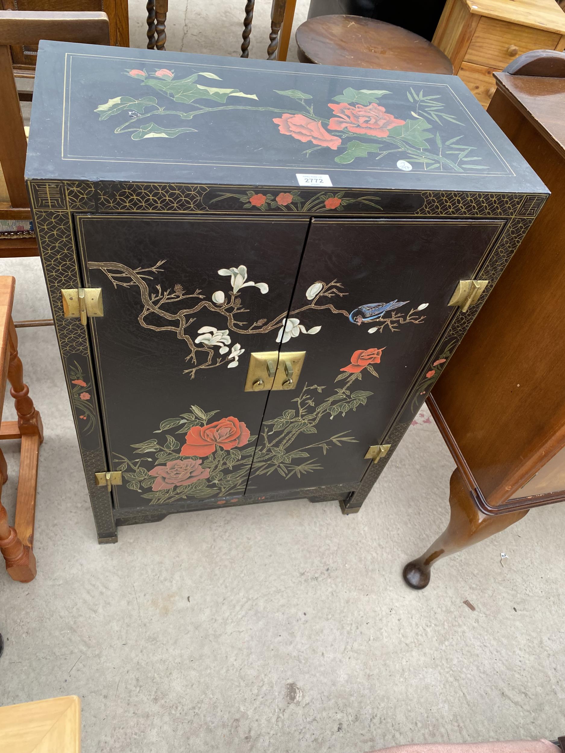A MODERN TWO DOOR CABINET WITH CHINOISERIE DECORATION, 24" WIDE