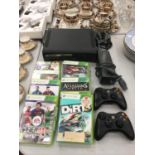 AN X-BOX 360 CONSOLE, POWER PACK, CONTROLLERS AND A QUANTITY OF GAMES TO INCLUDE FIFA '13, '14