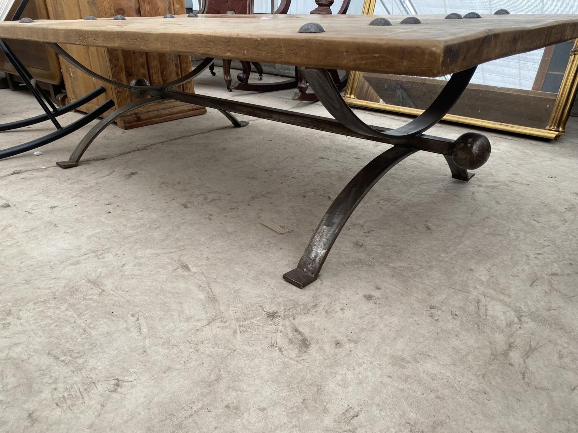 A RUSTIC THREE PLANK LOW TABLE ON METALWARE BASE WITH TWELVE STUDS, 60X35" - Image 3 of 4