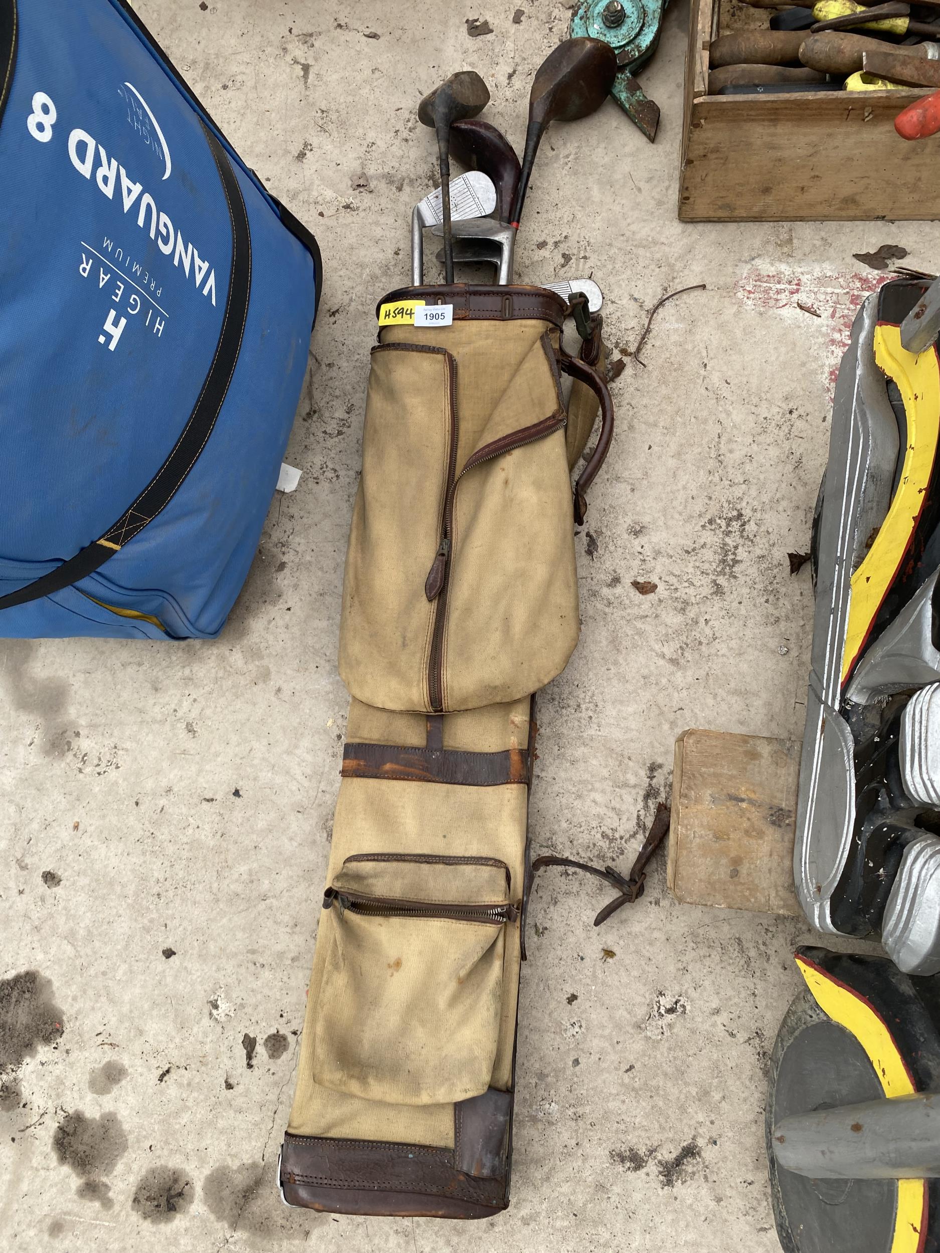 A BAG OF OLD WOODEN GOLF CLUBS