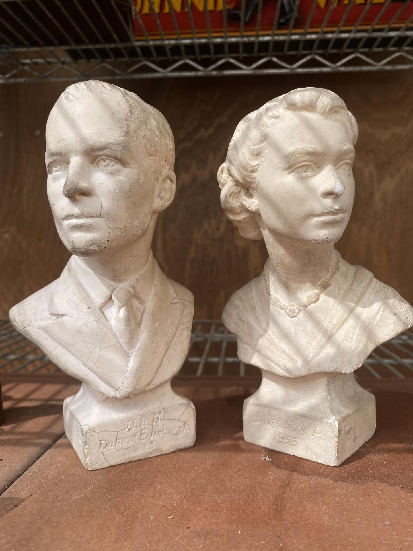 A PAIR OF VINTAGE STONE EFFECT BUSTS OF QUEEN ELIZABETH AND THE DUKE OF EDINBURGH