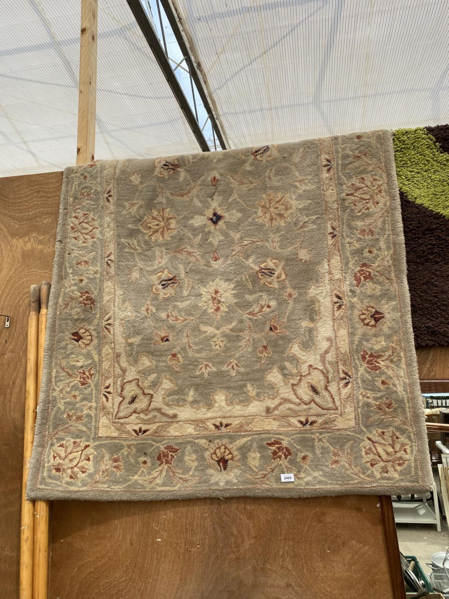 A CREAM PATTERNED RUG