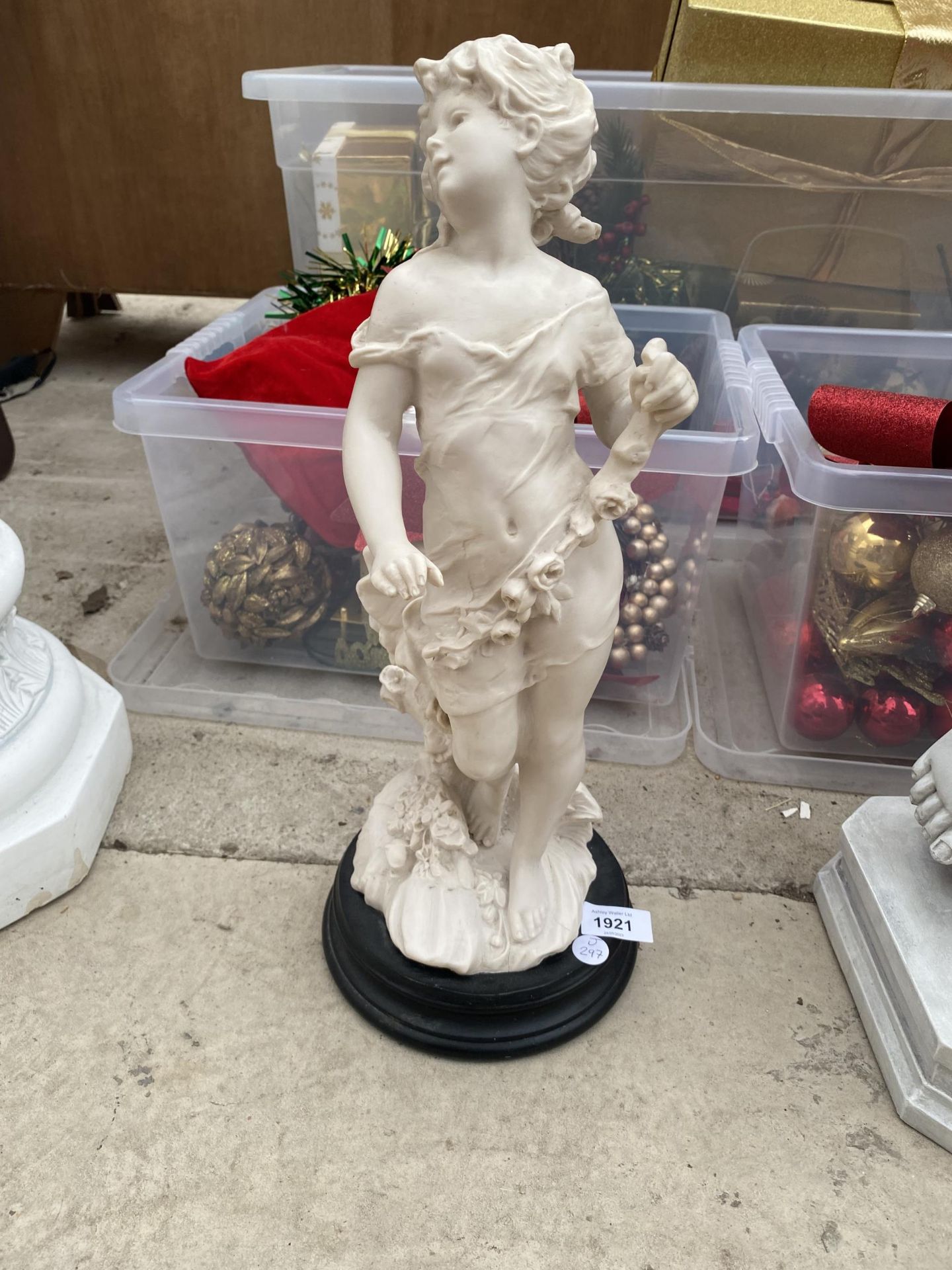A RESIN TYPE MODEL OF A LADY