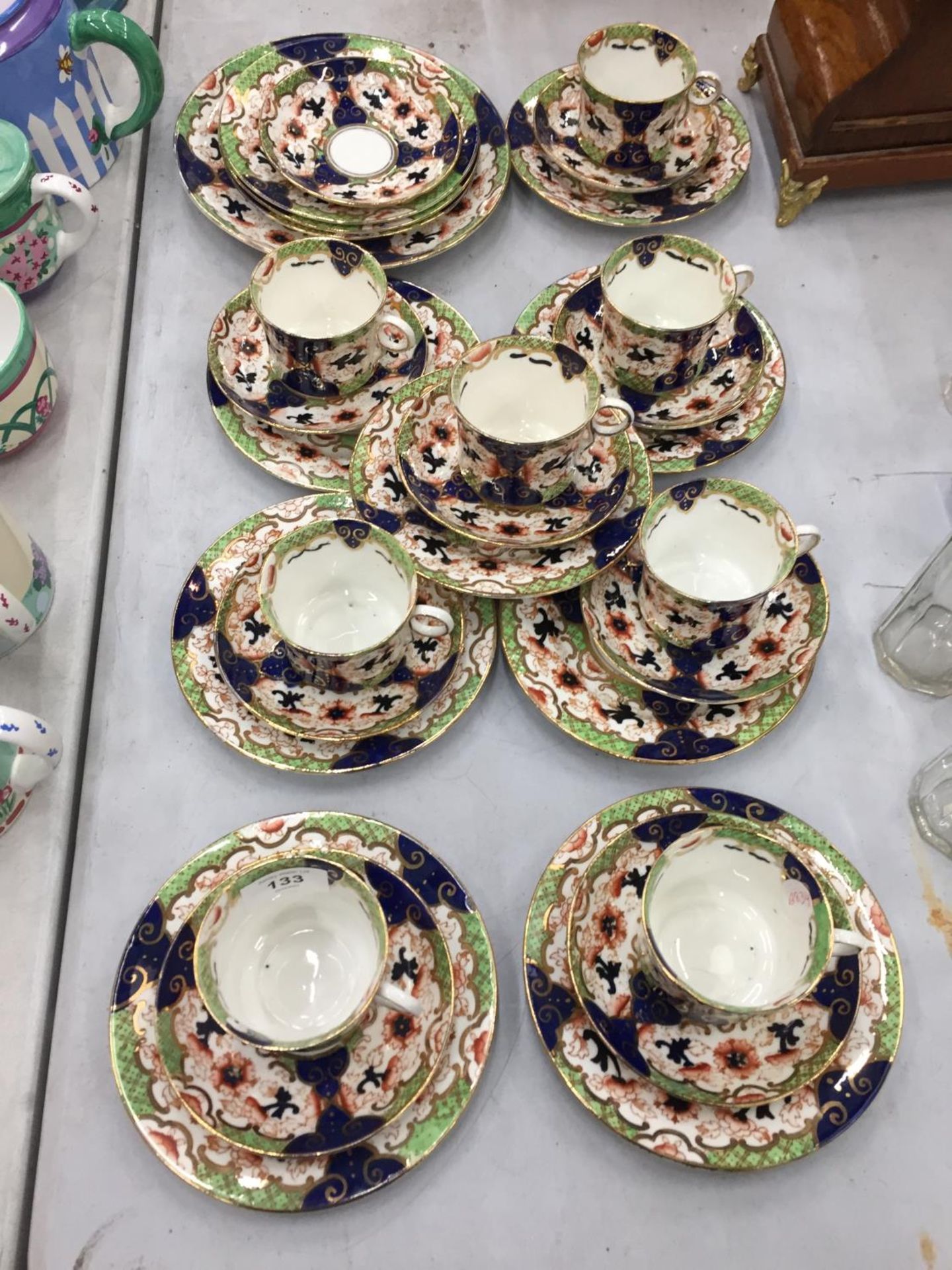 A COLLECTION OF VINTAGE ROYAL STAFFORD CUPS, SAUCERS AND SIDE PLATES