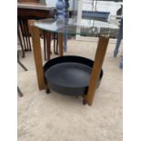A 19.5" DIAMETER GLASS TOP TABLE WITH METALWARE BASE SECTION