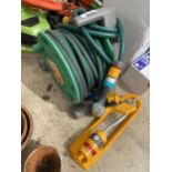 A HOZELOCK HOSE AND REEL AND FURTHER ATTACHMENT