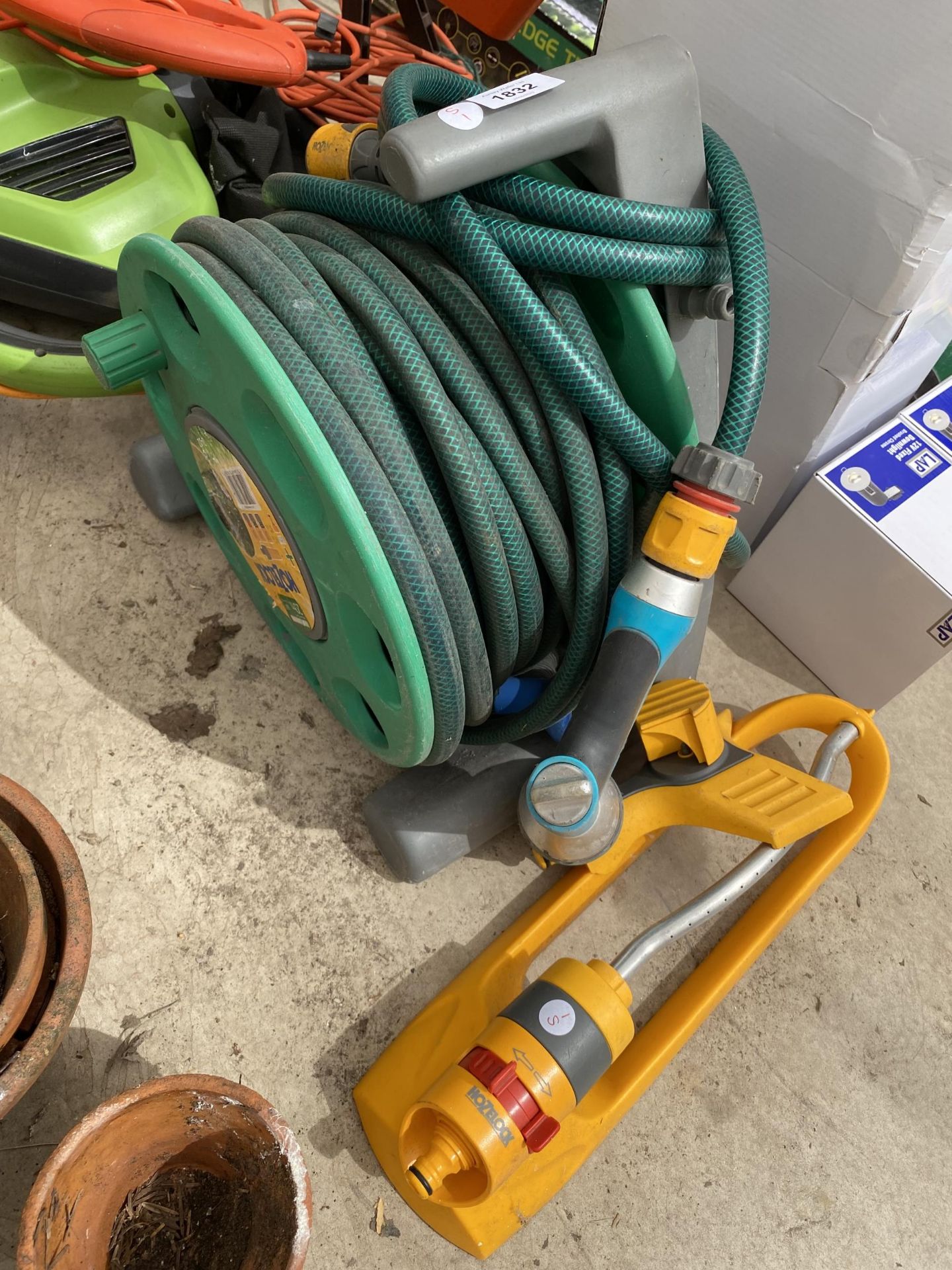 A HOZELOCK HOSE AND REEL AND FURTHER ATTACHMENT