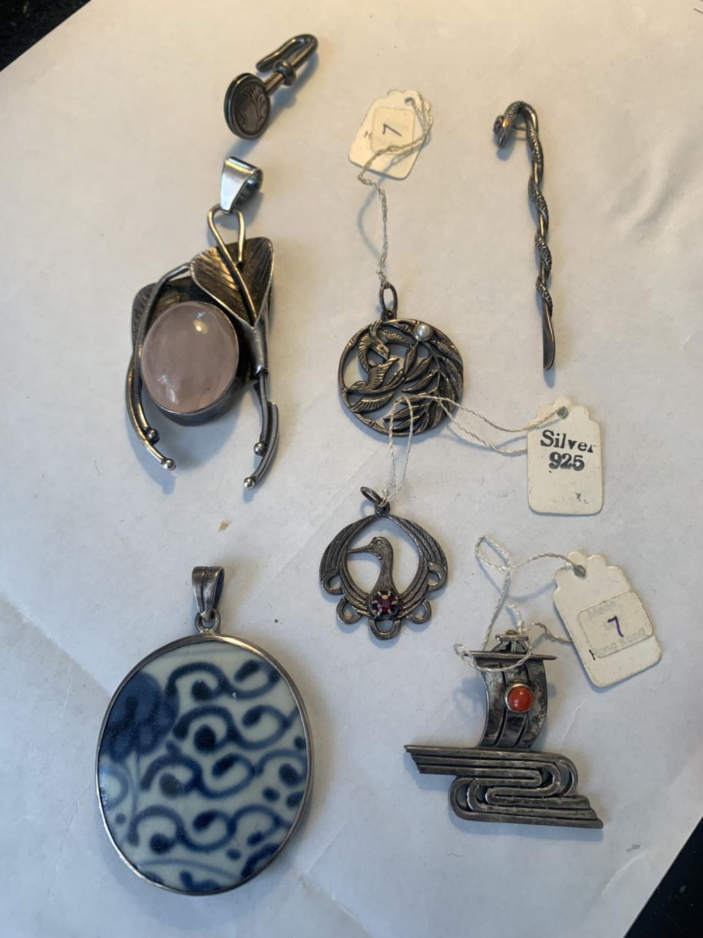 SEVEN SILVER ITEMS TO INCLUDE FIVE PENDANTS