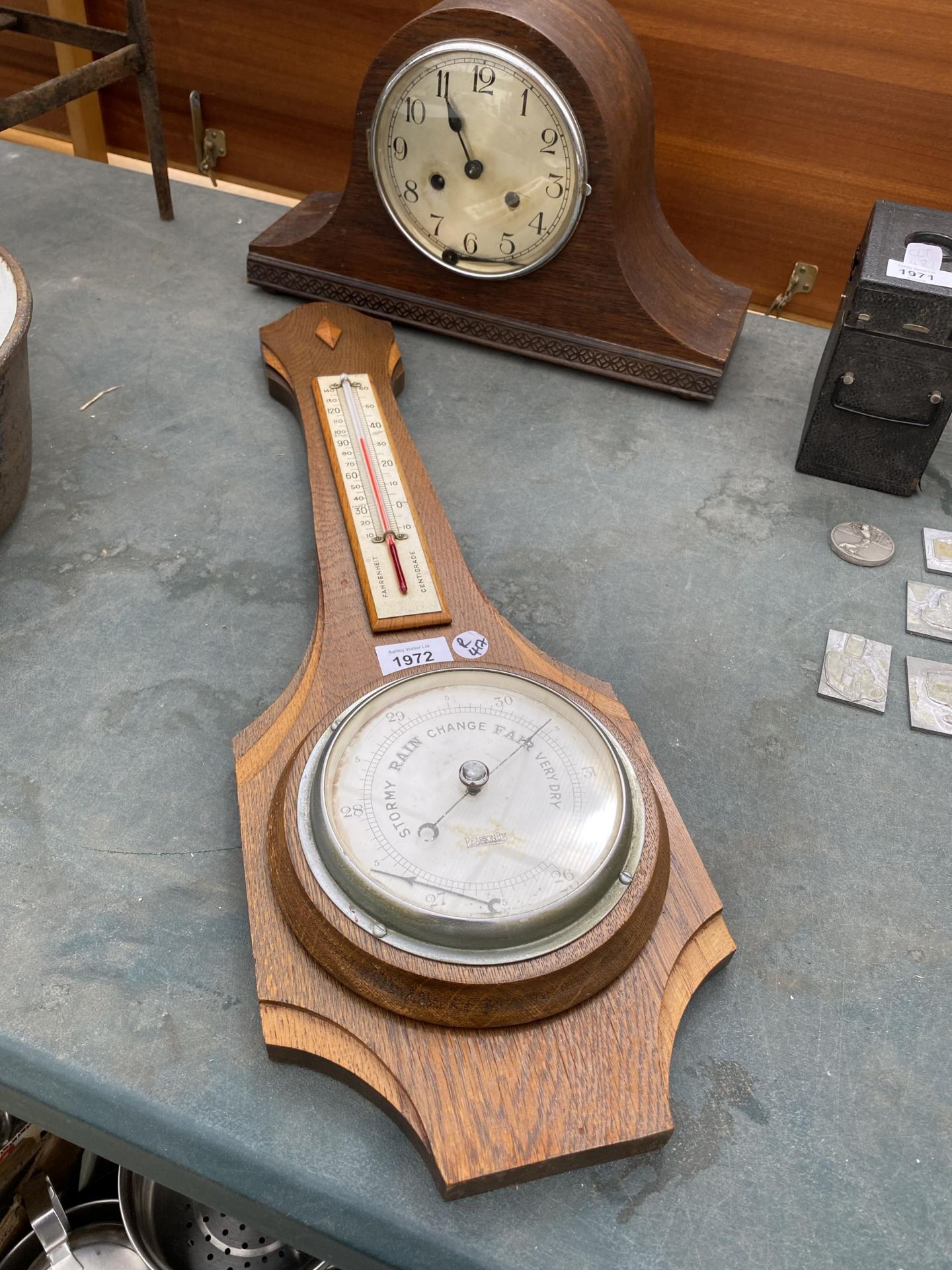 AN OAK CHIMING MANTLE CLOCK AND OAK BAROMETER