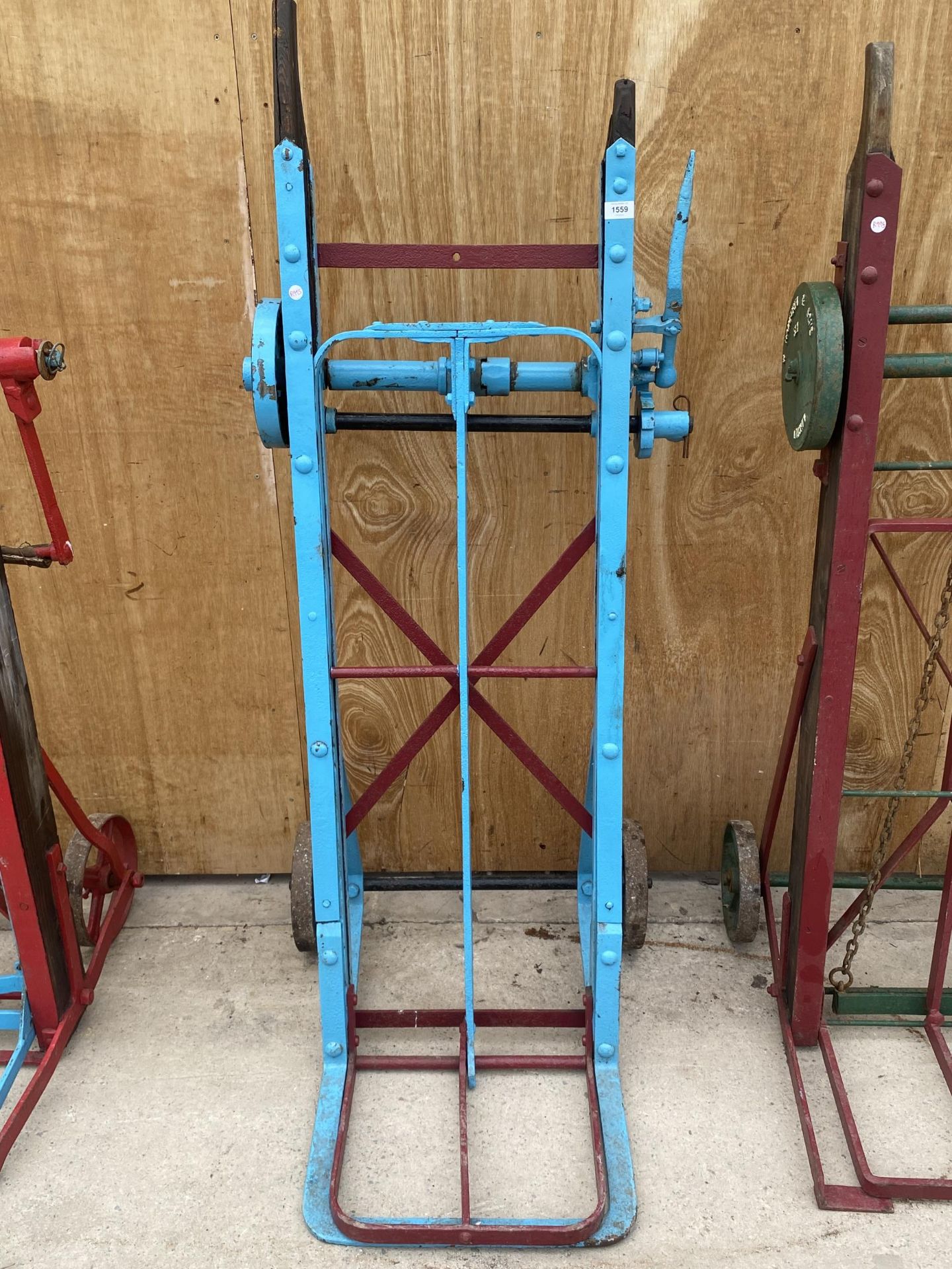 A VINTAGE WOODEN AND STEEL RAILWAY TROLLEY BEARING THE NAME 'COOKS PATENT YAXLEY'