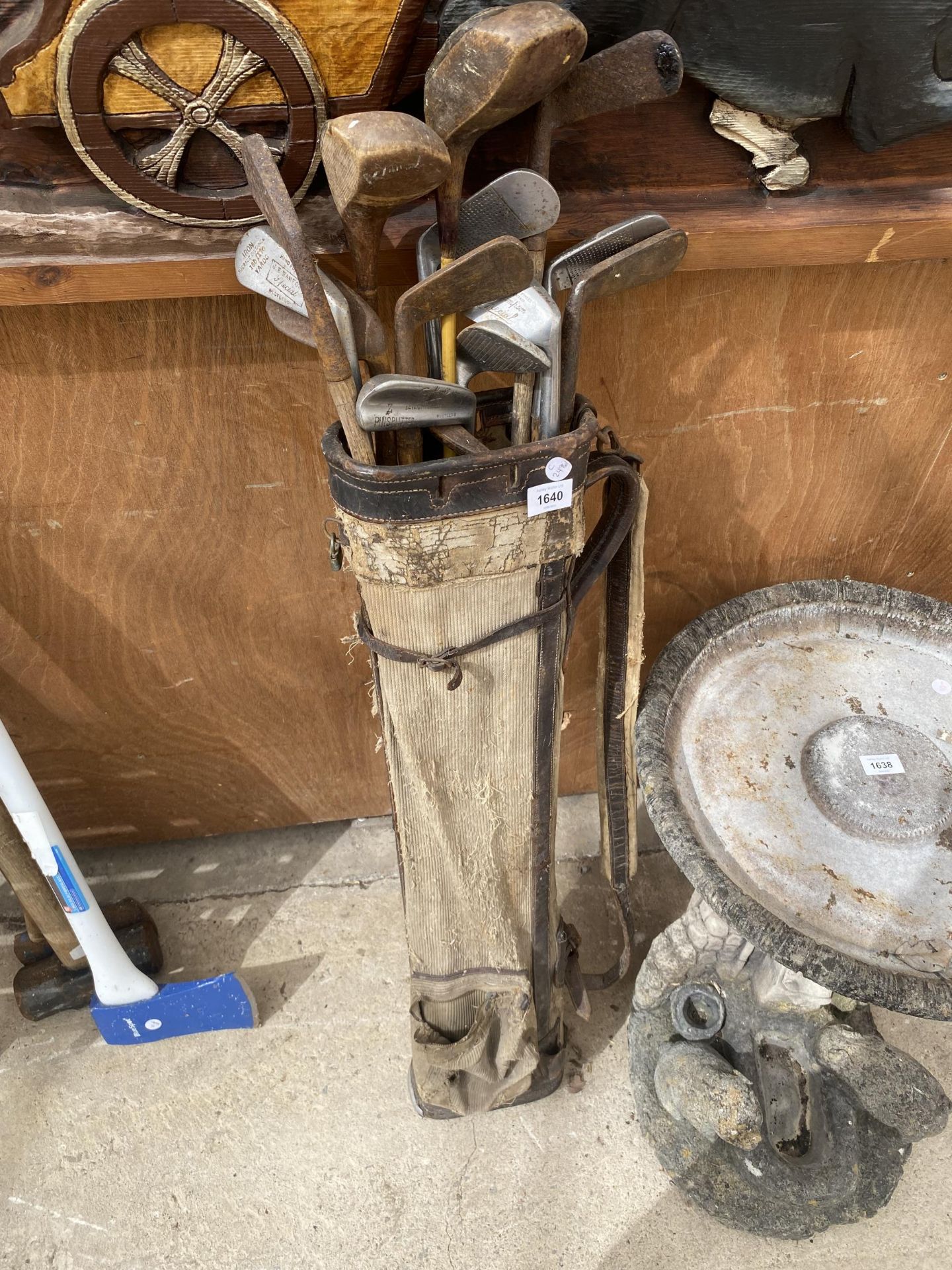 A SET OF VINTAGE WOODEN AND FURTHER GOLF CLUBS