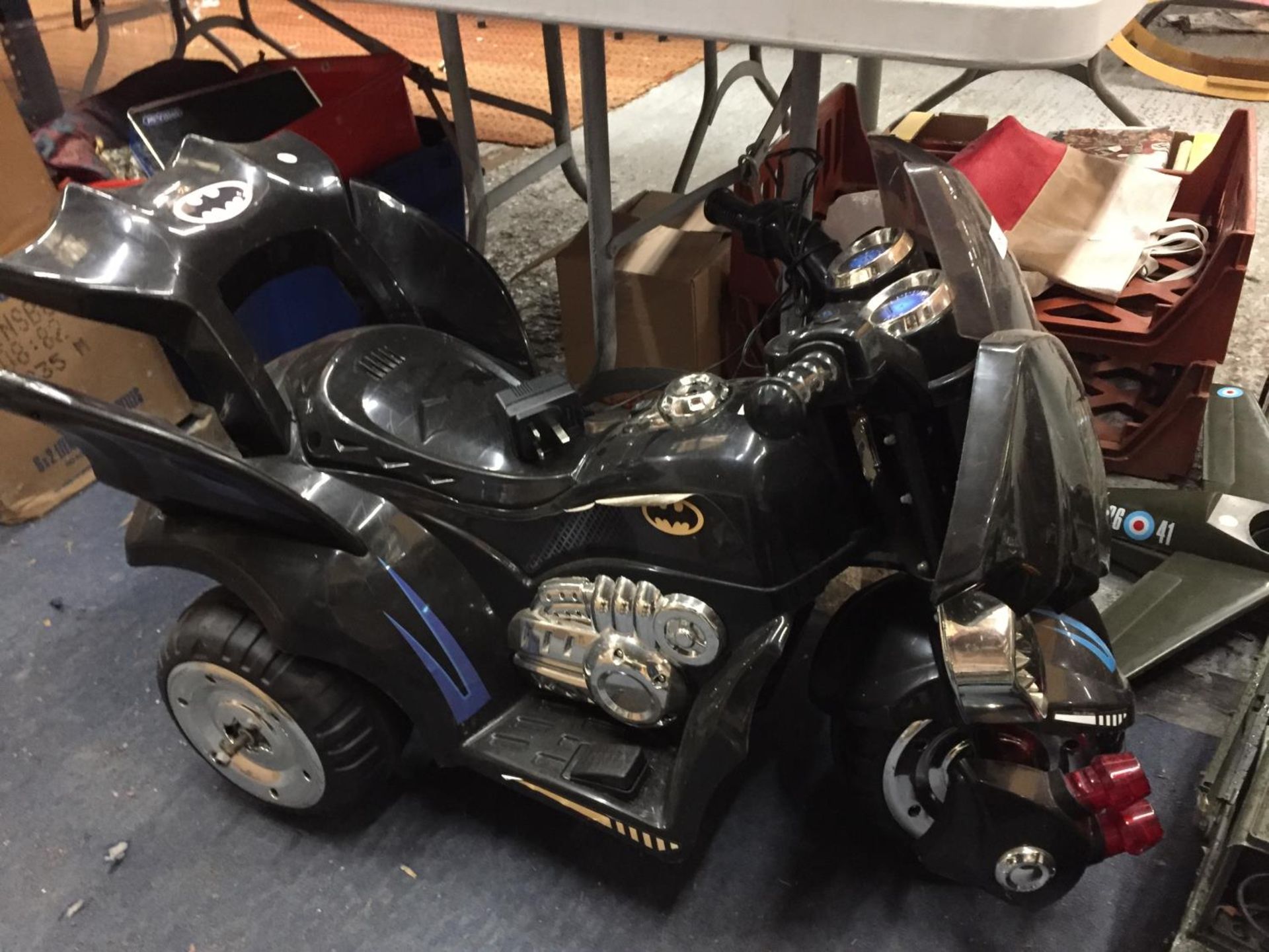 A 'BATMAN' BATTERY POWERED CHILD'S THREE WHEELED BIKE WITH CHARGER