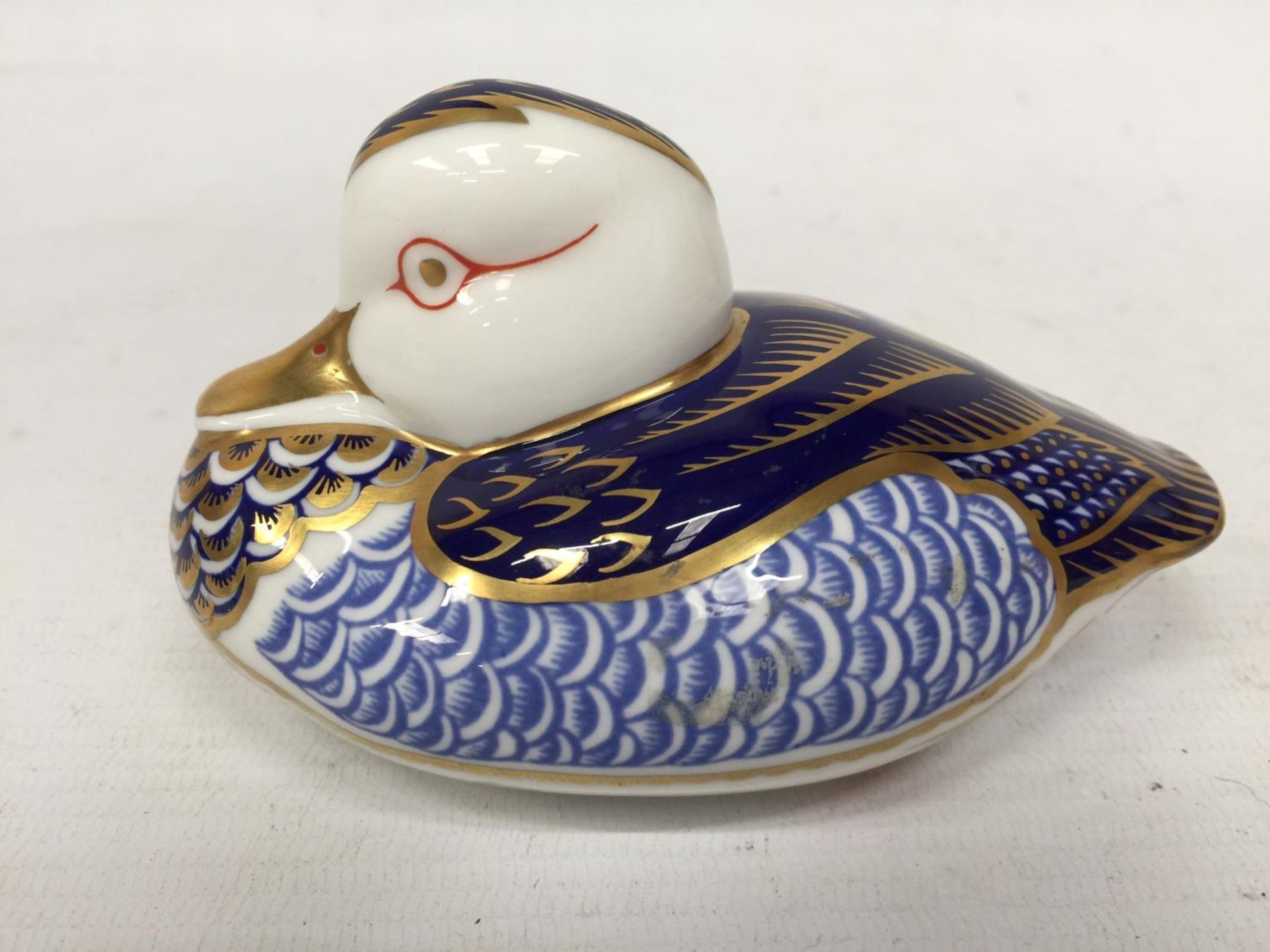 A ROYAL CROWN DERBY DUCK WITH GOLD STOPPER