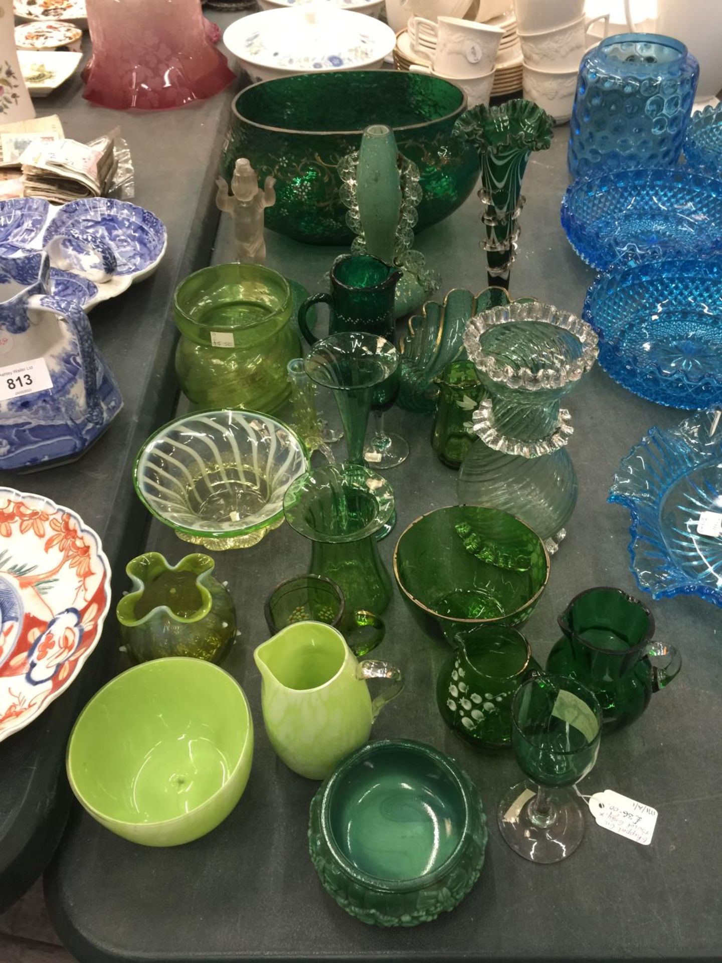 A LARGE QUANTITY OF GREEN COLOURED GLASSWARE TO INCLUDE HANDPAINTED EXAMPLES, BOWLS, VASES, JUGS,