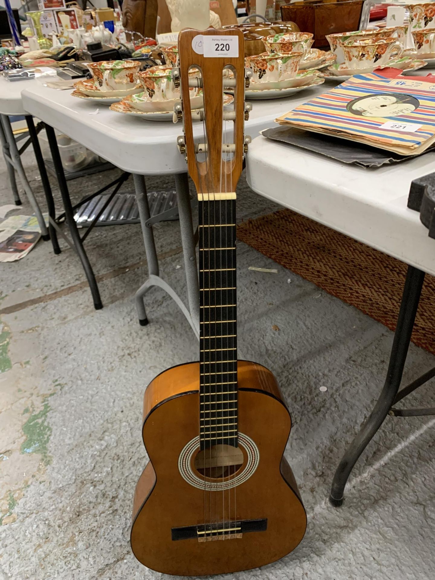 A VINTAGE WOODEN ACOUSTIC GUITAR