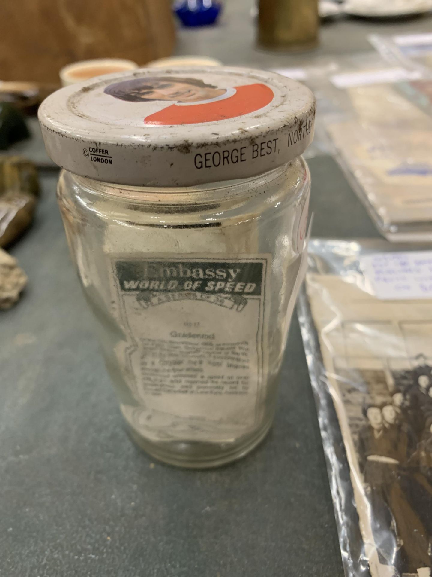 A GEORGE BEST JAR WITH CIGARETTE CARDS