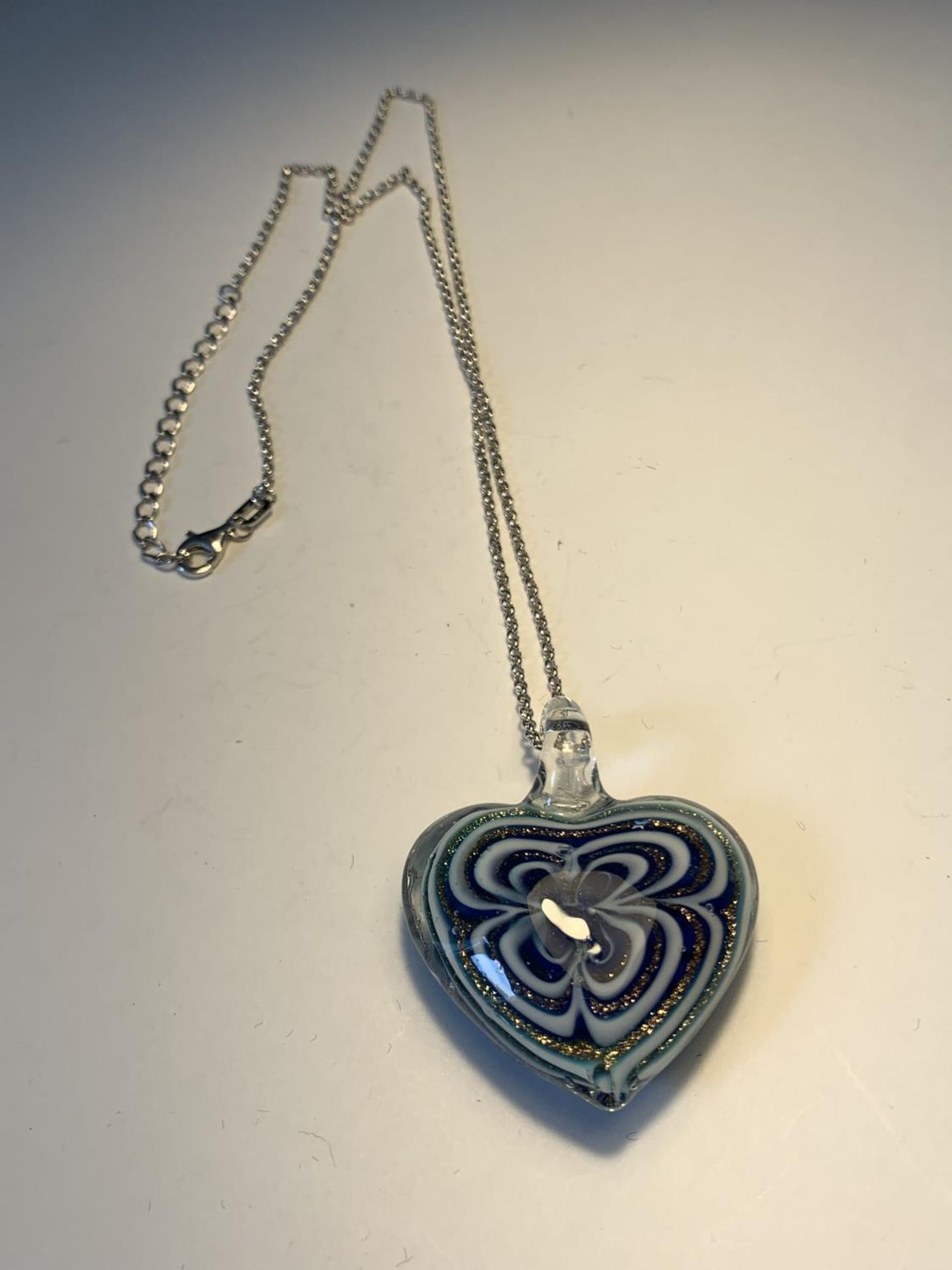 A MURANO GLASS HEART PENDANT ON A SILVER NECKLACE