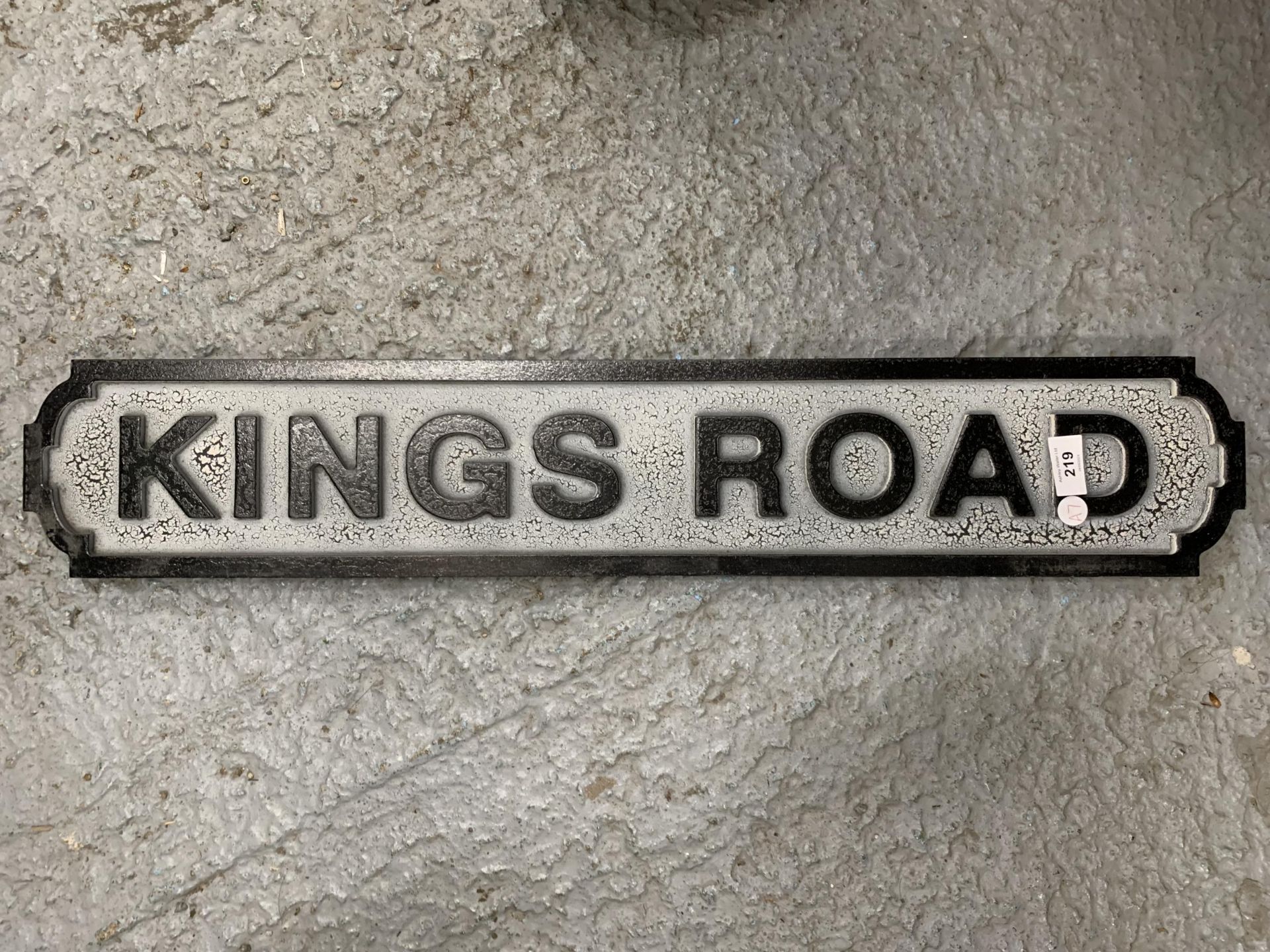 A WOODEN KINGS ROAD STREET SIGN