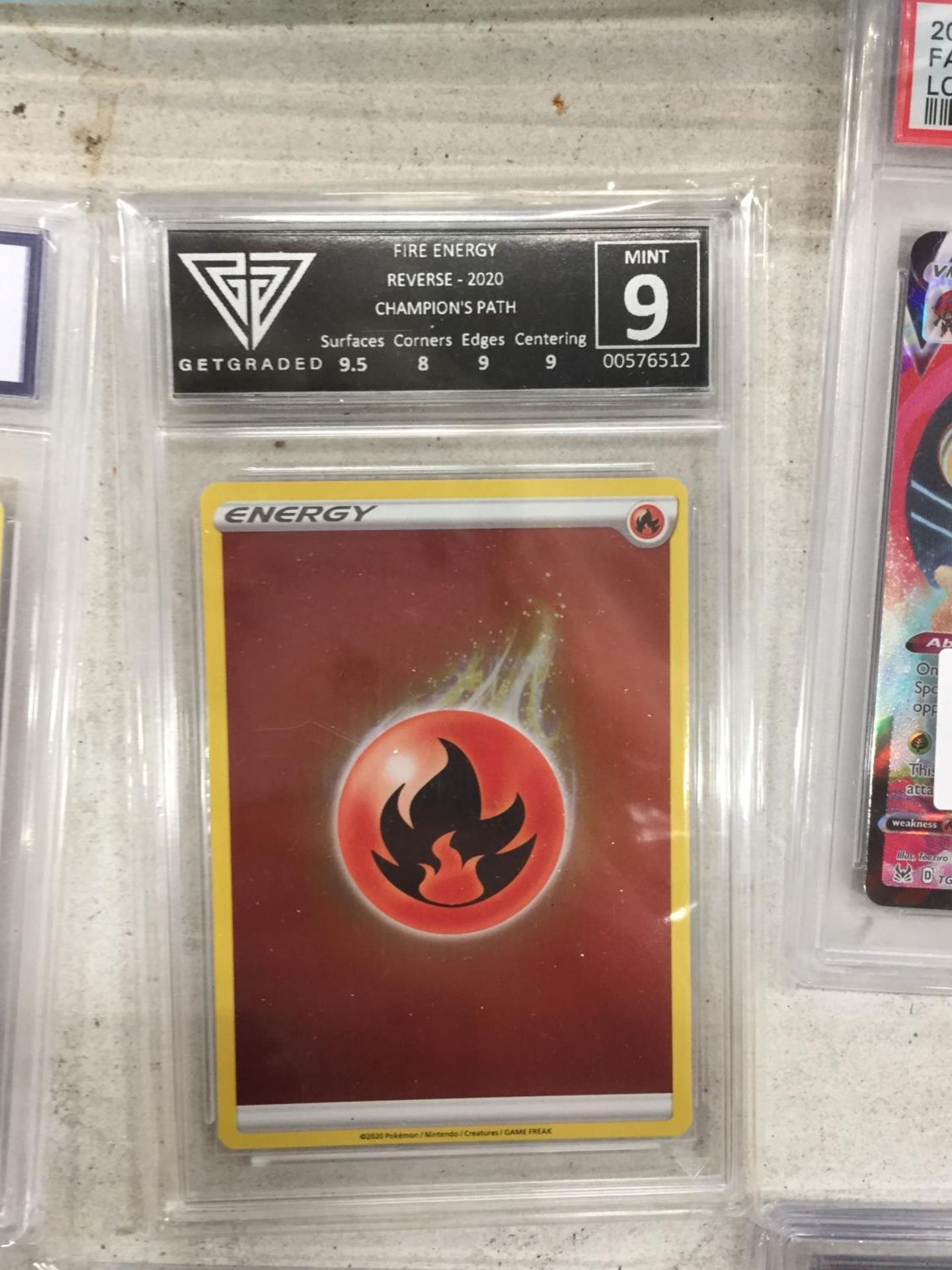 A GET GRADED 9/10 'CHAMPIONS PATH' HOLO FIRE ENERGY 2020 TRADING CARD