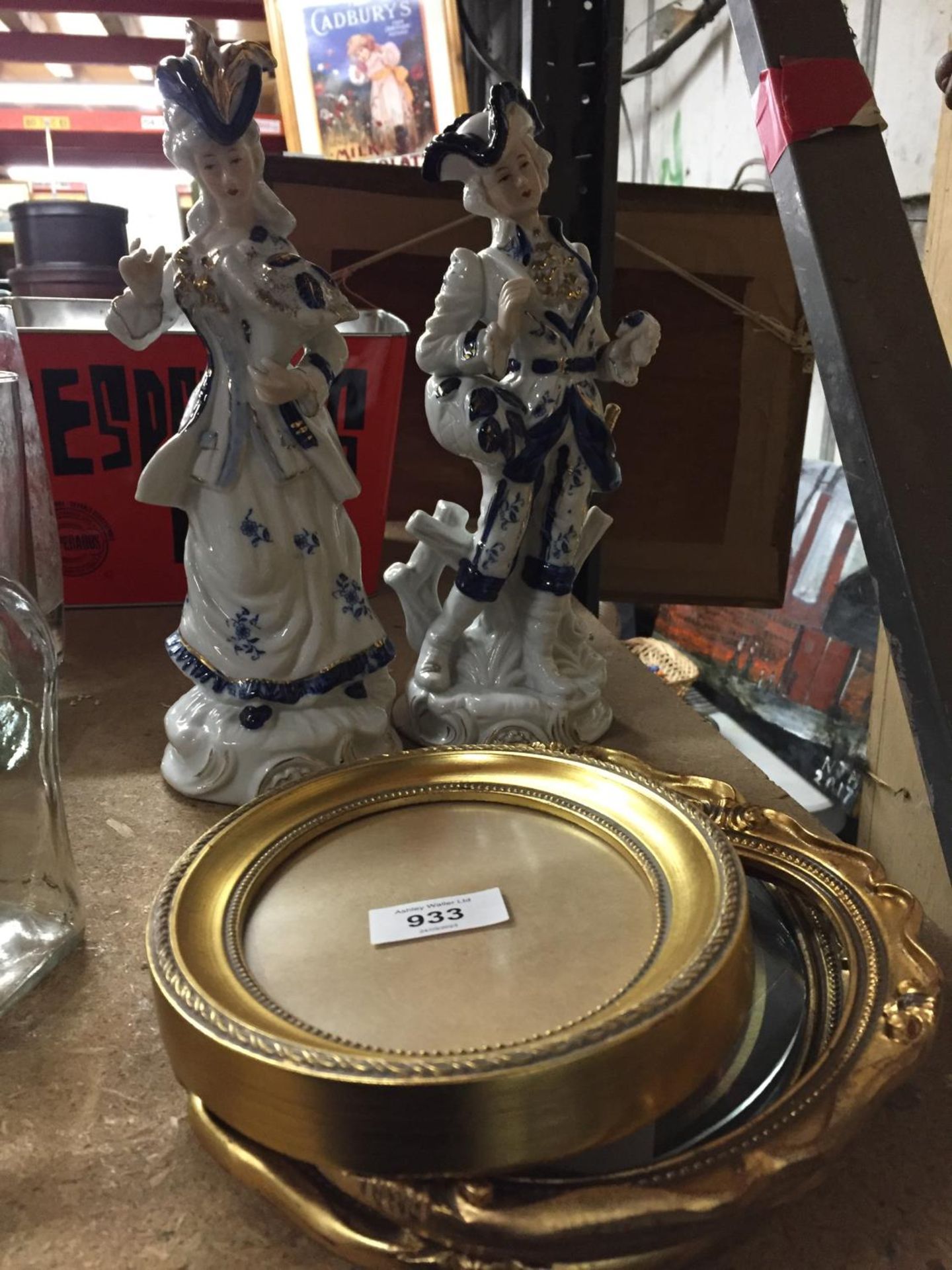 A PAIR OF CONTINENTAL FIGURES PLUS THREE SMALL GILT PICTURE FRAMES