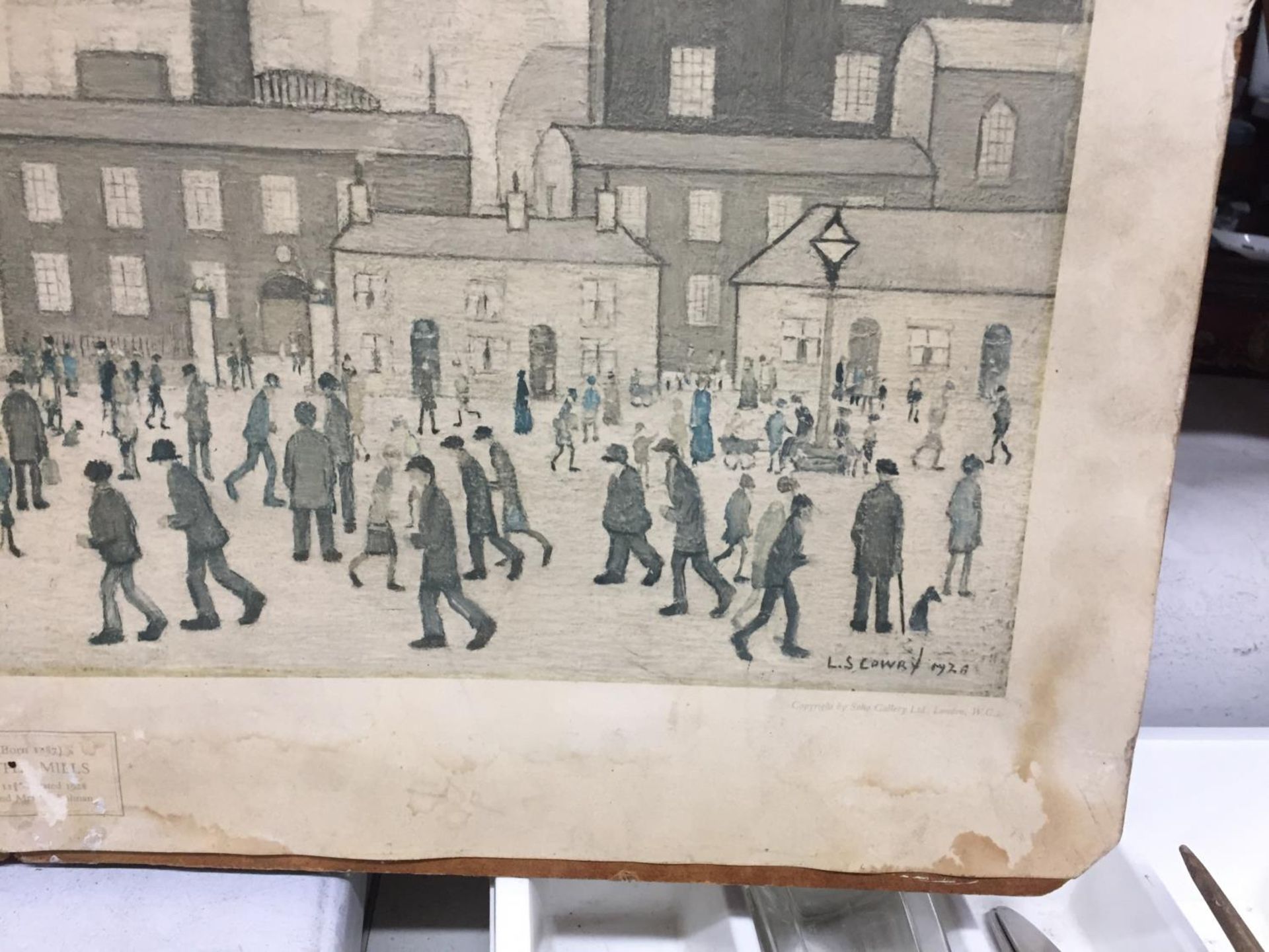 AN L S LOWRY PRINT ON BOARD - VERY FADED - Image 2 of 2