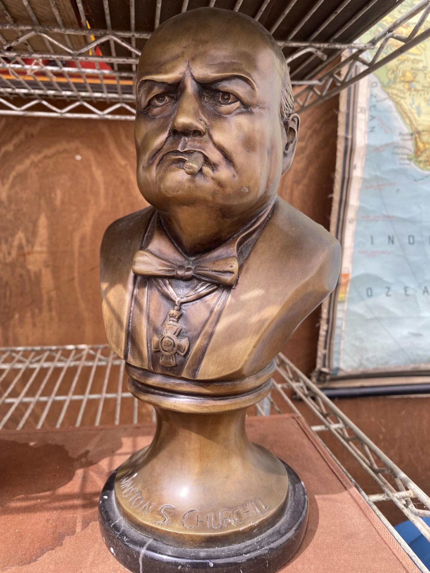 A REPRODUCTION BRONZE BUST OF WINSTON CHURCHILL ON MARBLE BASE