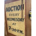 A VINTAGE WOODEN 'AUCTION EVERY WEDNESDAY' SIGN