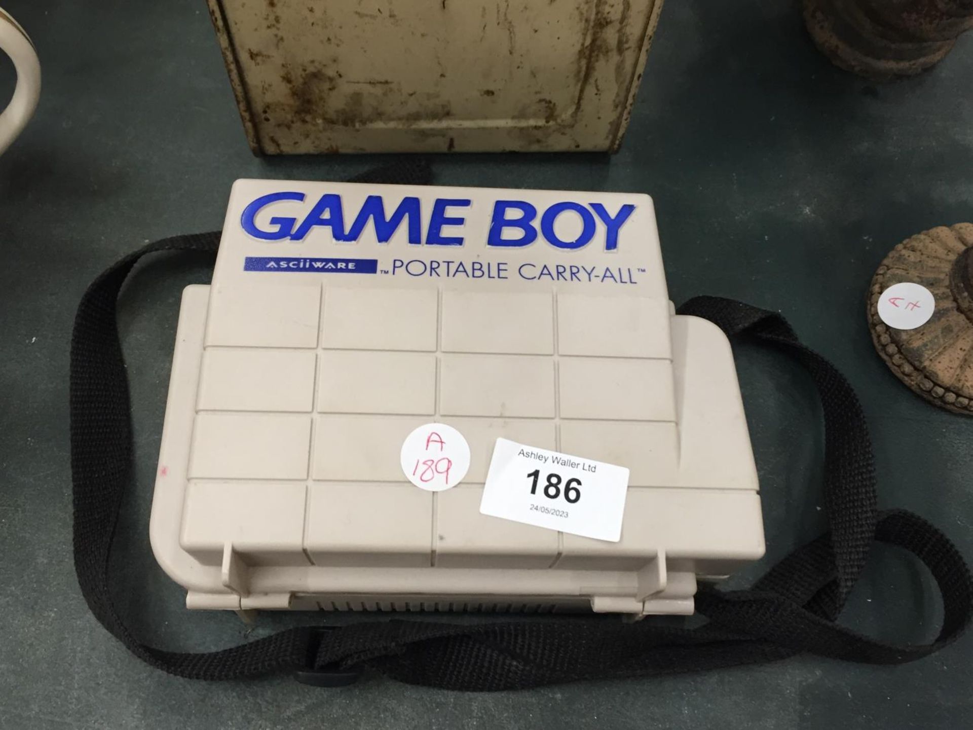 A VINTAGE NINTENDO IN A PLASTIC CARRY CASE - A/F
