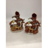 A PAIR OF VINTAGE STAFFORDSHIRE STYLE SPILL HOLDERS WITH FIGURE AND FAUNA DECORATION HEIGHT 17.5CM