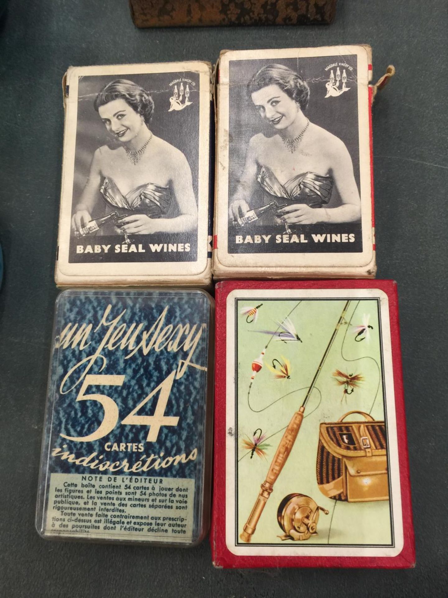 FOUR PACKETS OF VINTAGE PLAYING CARDS