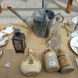 AN ASSORTMENT OF ITEMS TO INCLUDE A GALVANISED WATERING CAN, STONWARE BOTTLES AND A GLASS LAMP ETC