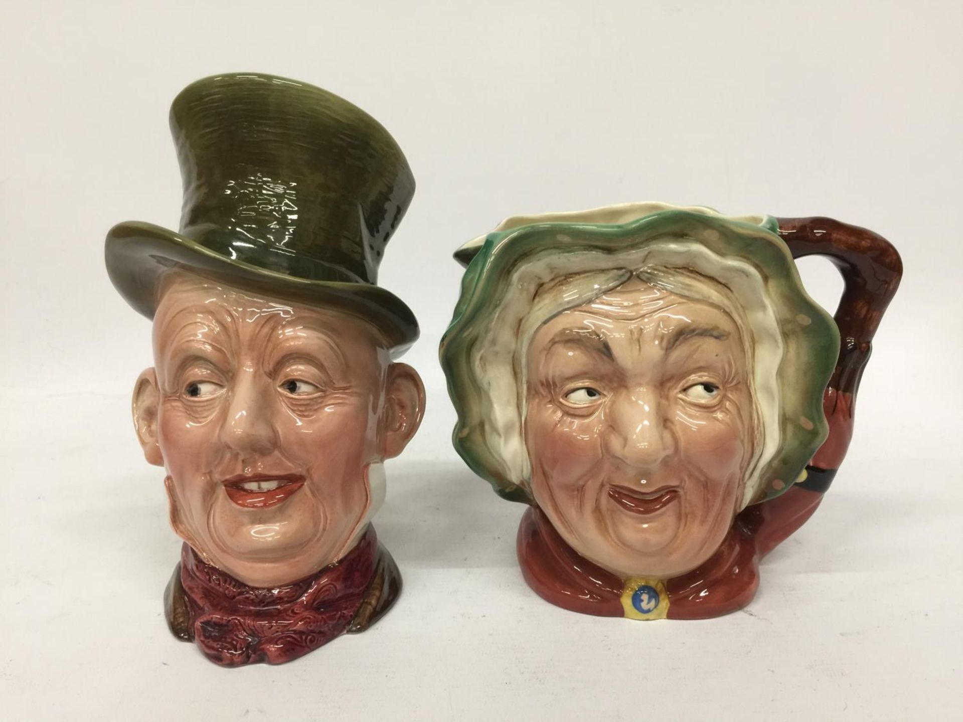 TWO BESWICK CHARACTER JUGS - MICAWBER AND SAIREY GAMP - 23CM AND 16.5 CM