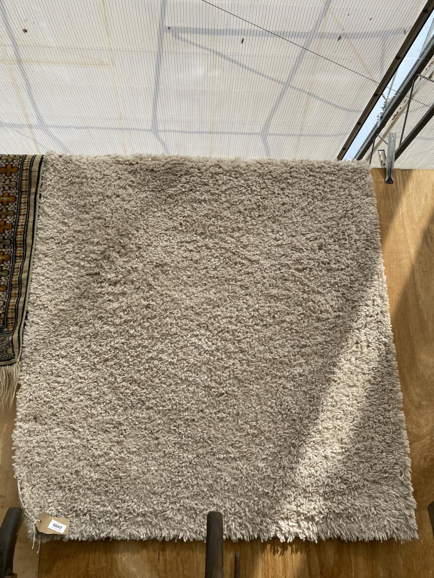 A MODERN CREAM RUG