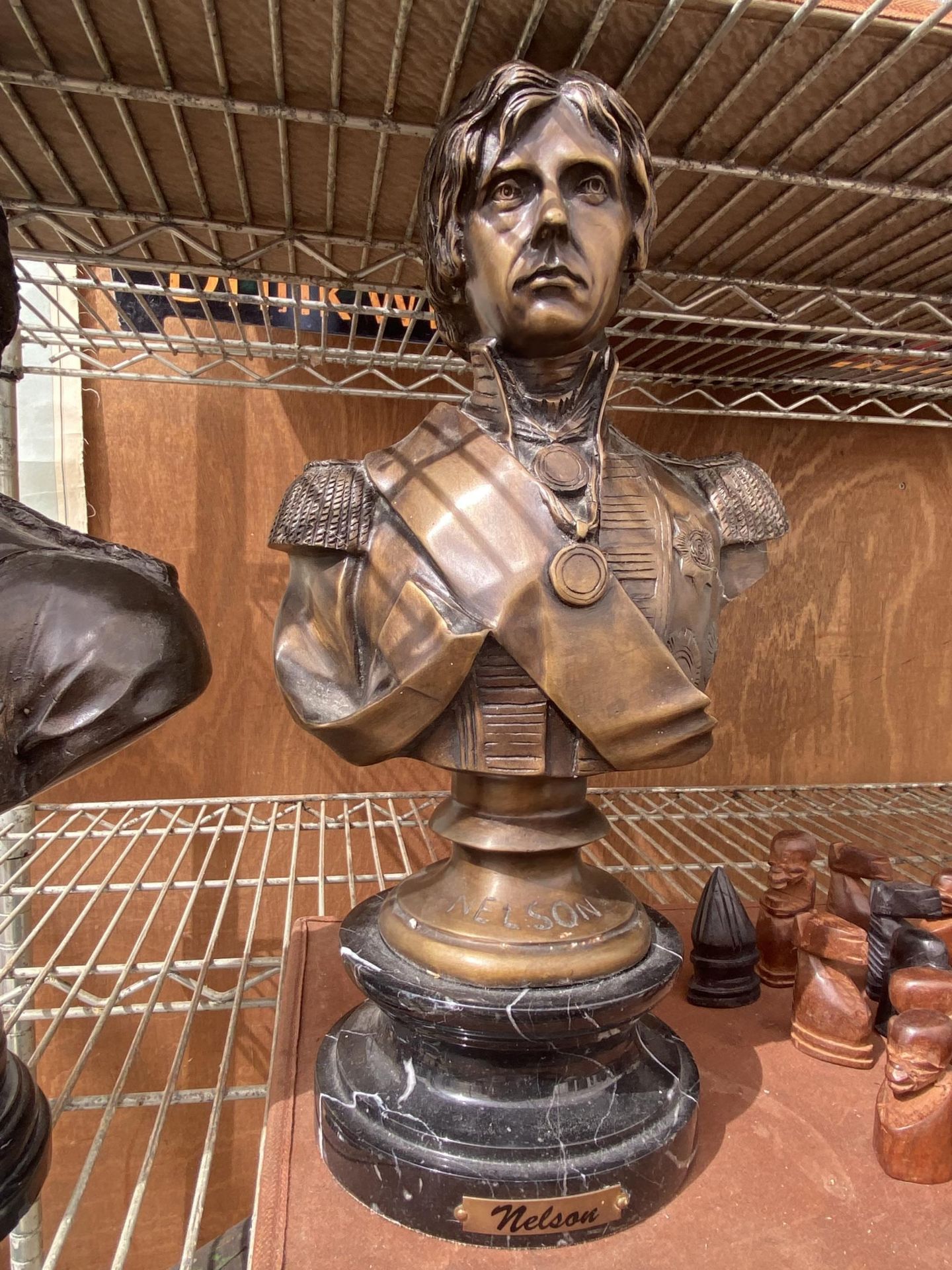 A REPRODUCTION BRONZE BUST OF NELSON ON MARBLE BASE