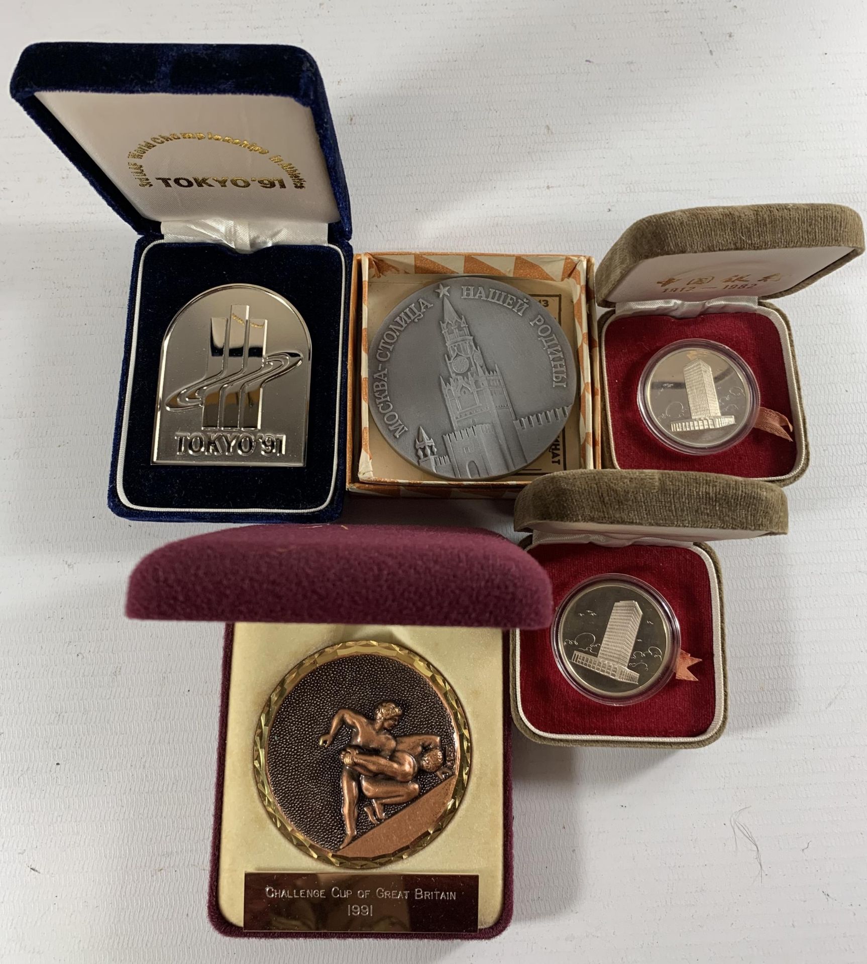 * A COLLECTION OF CASED MEDALS RELATING TO SPORT, BANKING AND RUSSIA