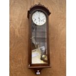 AN ARIGHI BIANCHI CHIMING VIENNA STYLE WALL CLOCK WITH PENDULUM