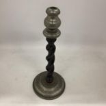 AN ARTS AND CRAFTS PEWTER CANDLESTICK WITH BARLEY TWIST WOODEN STEM AND PEWTER TOP AND BASE