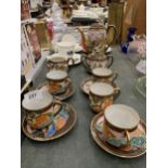 AN ORIENTAL STYLE COFFEE SET TO INCLUDE A COFFEE POT, CREAM JUG, SUGAR BOWL, CUPS AND SAUCERS PLUS A