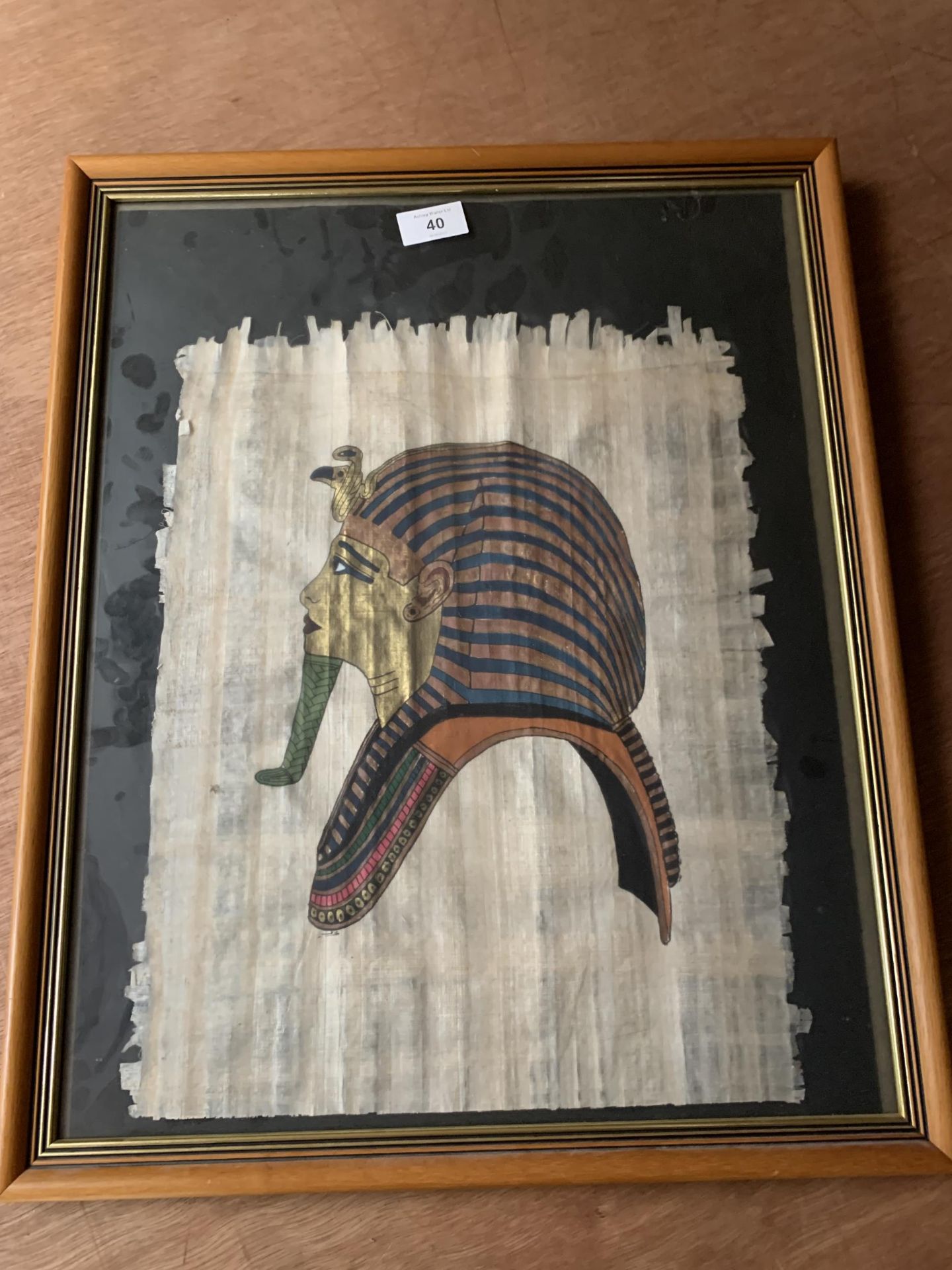 * AN EGYPTIAN IMAGE OF TUTANKHAMUNS MASK ON PAPYRUS, 50 X 39CM, VERSO WITH PRESENTATION CARD TO