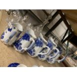 A SET OF FIVE VINTAGE GRADUATED BLUE AND WHITE JUGS