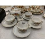 A VINTAGE CHILD'S CERAMIC TEASET TO INCLUDE FOOUR CUPS AND SAUCERS, A TEAPOT AND A CREAM JUG
