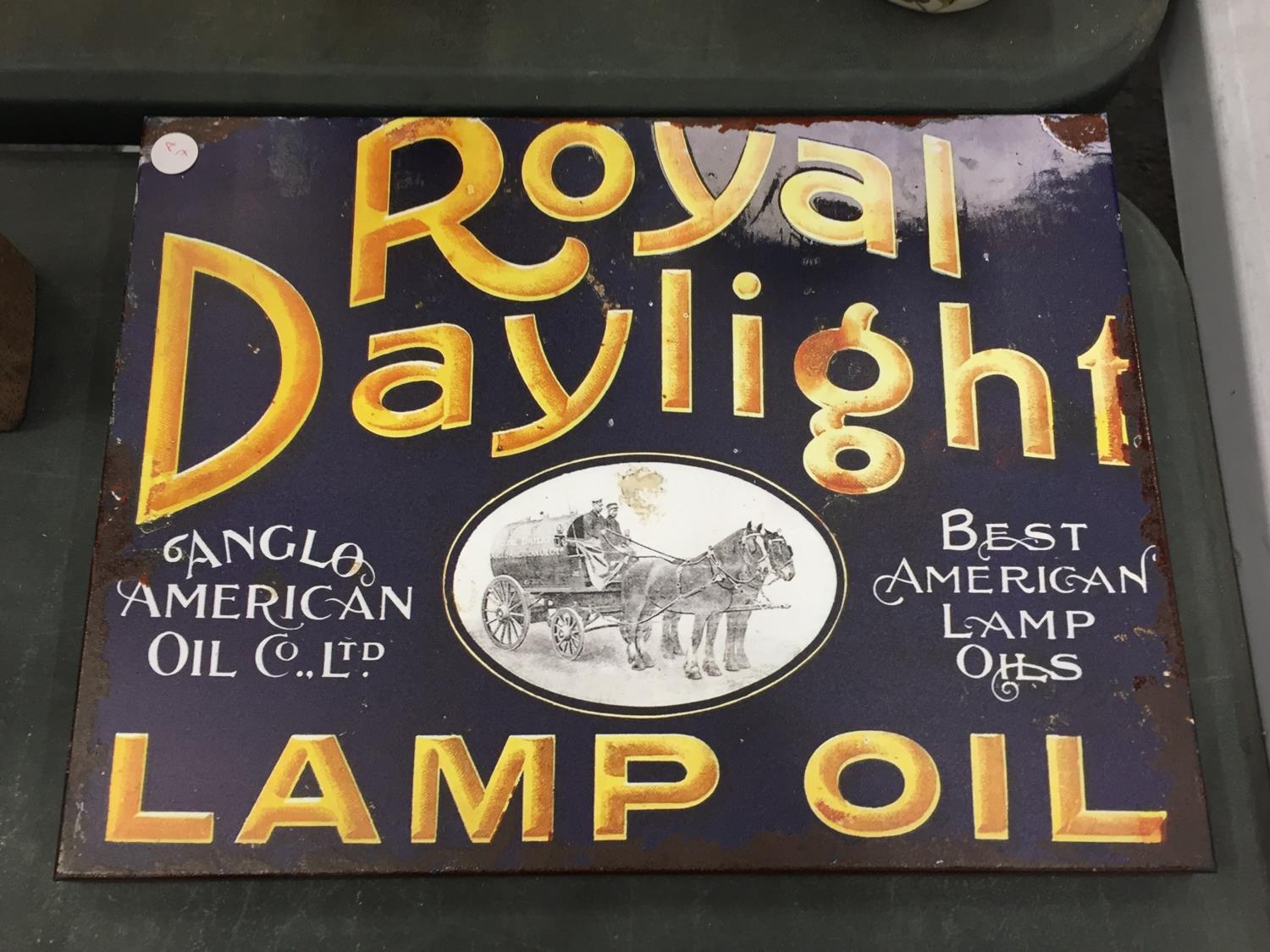 A 'ROYAL DAYLIGHT LAMP OIL' TIN SIGN 40CM X 30CM