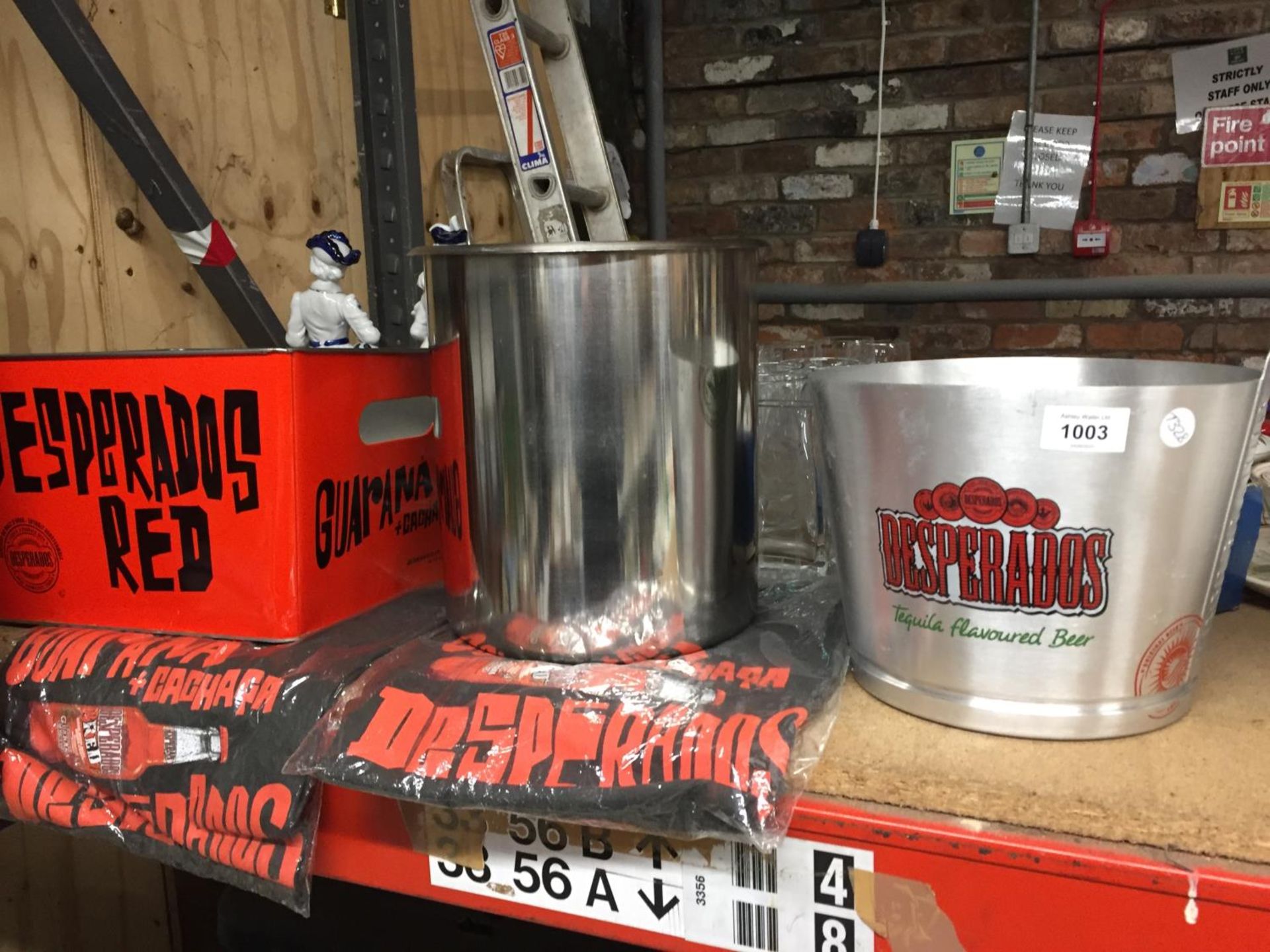 A QUANTITY OF 'DESPERADOS' BEER ITEMS TO INCLUDE T-SHIRTS, AN ICE BUCKET, TIN, ETC