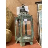 A DECORATIVE VINTAGE STYLE METAL CANDLE LANTERN