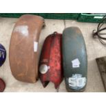 A GROUP OF VINTAGE METAL MOTORBIKE MUD GUARDS AND RED PETROL / FUEL TANK